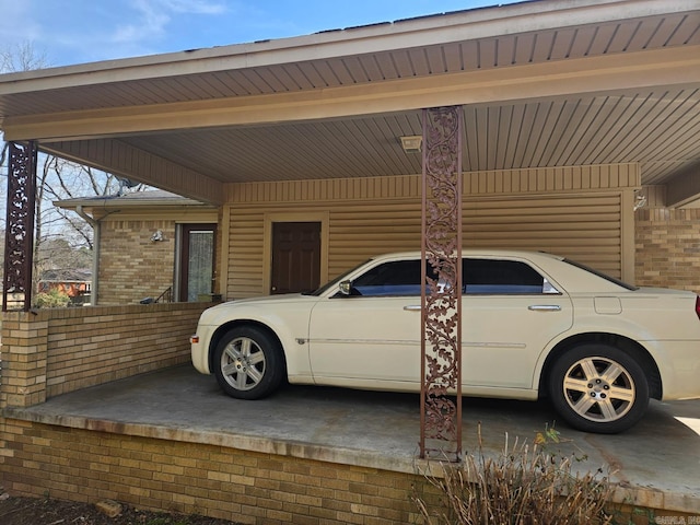 exterior space featuring a carport and brick siding