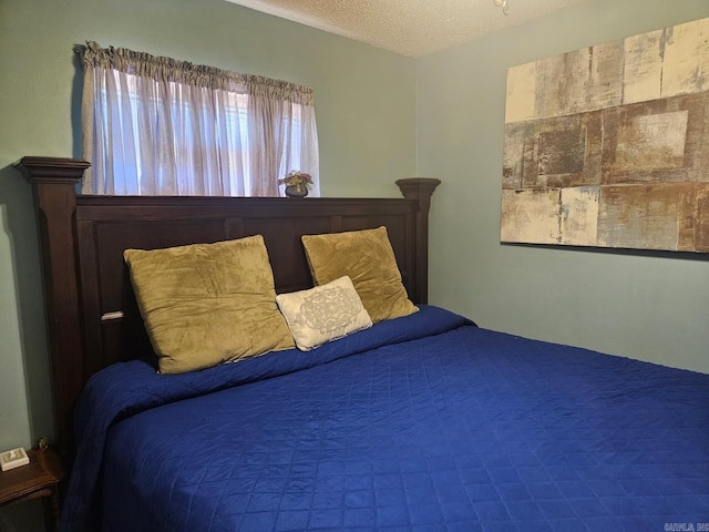 bedroom featuring a textured ceiling