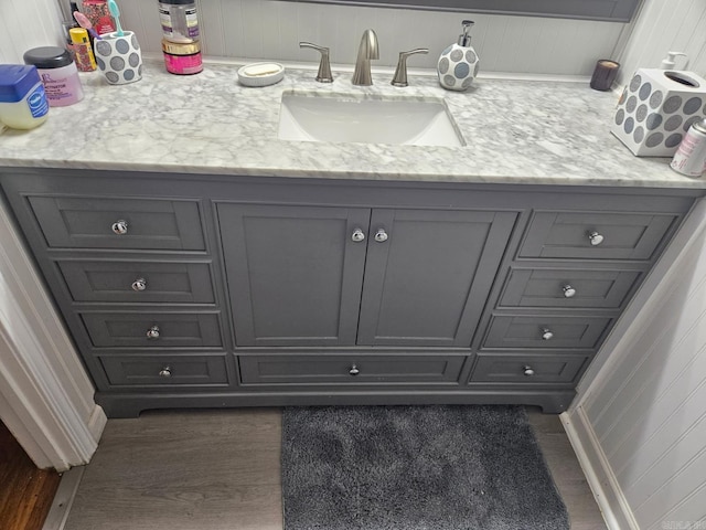 bathroom featuring wood finished floors and vanity