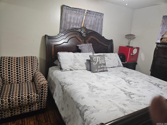 bedroom featuring wood finished floors