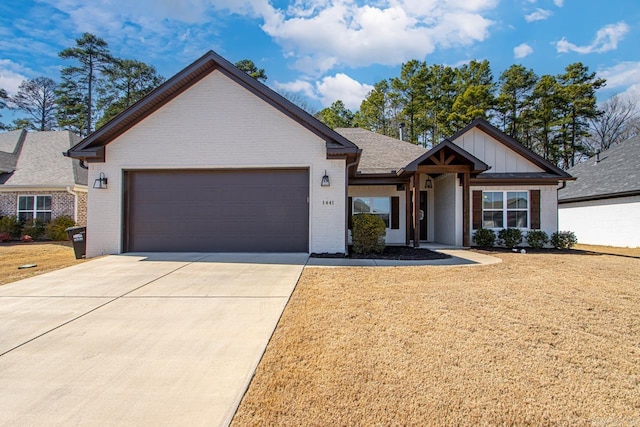 view of front of home featuring brick siding, concrete driveway, an attached garage, board and batten siding, and a front lawn