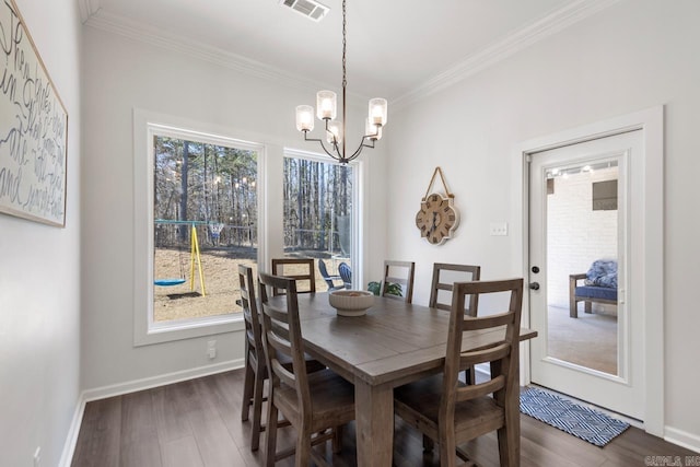 dining area featuring ornamental molding, dark wood-style flooring, visible vents, and baseboards