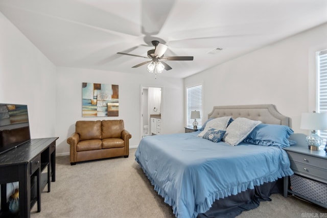 bedroom featuring a ceiling fan, light carpet, visible vents, and multiple windows