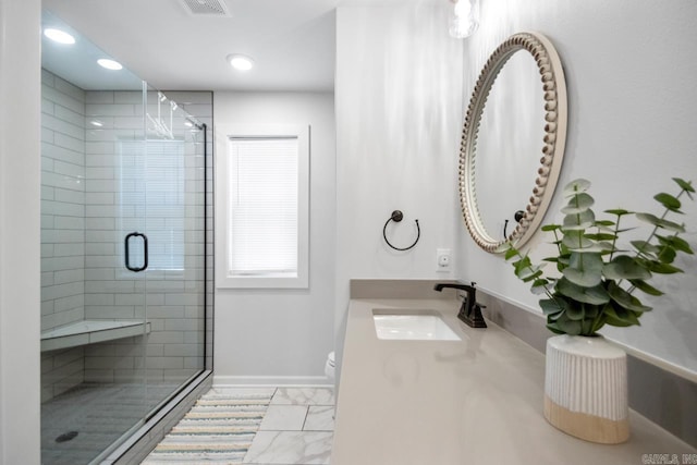 full bath with toilet, vanity, baseboards, marble finish floor, and a shower stall