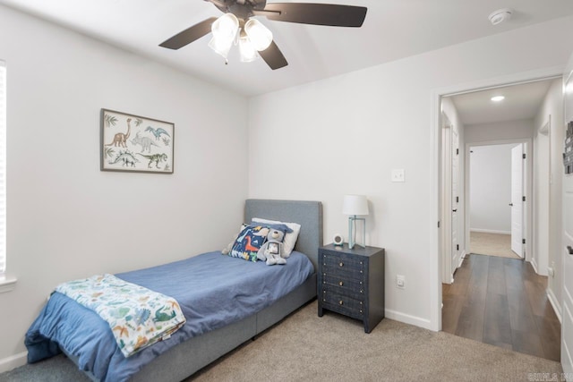 bedroom featuring carpet flooring, ceiling fan, and baseboards