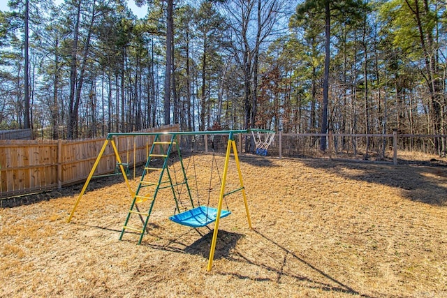 view of jungle gym featuring a fenced backyard