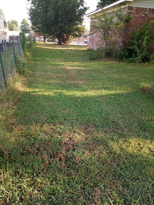 view of yard with fence