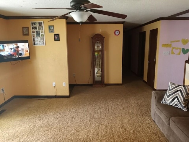 living room featuring baseboards, carpet, and crown molding