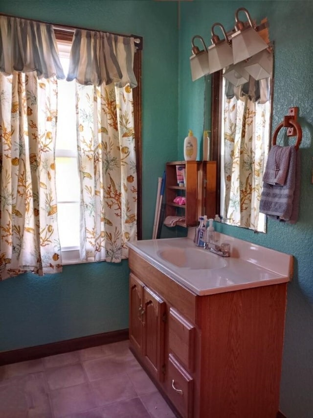 bathroom featuring tile patterned floors and vanity