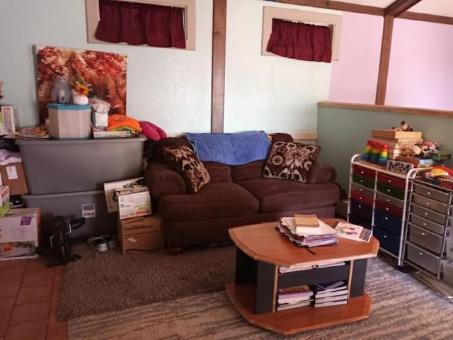 living area with tile patterned floors