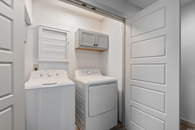 laundry room featuring cabinet space and washing machine and clothes dryer