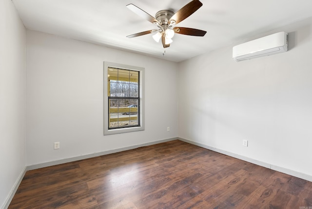 empty room with ceiling fan, baseboards, an AC wall unit, and wood finished floors