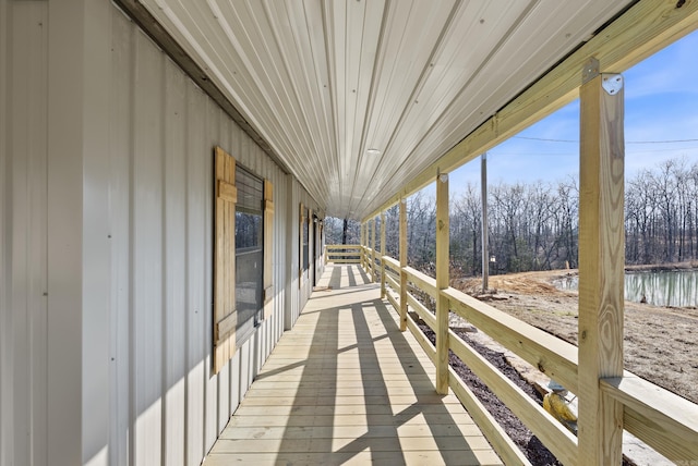 wooden deck featuring a water view