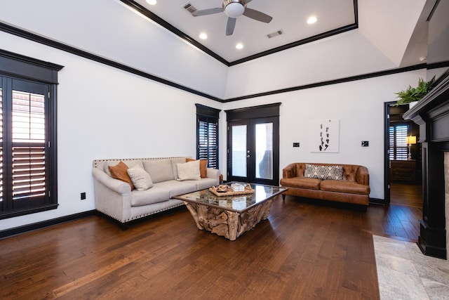 living area featuring french doors, visible vents, crown molding, and hardwood / wood-style flooring