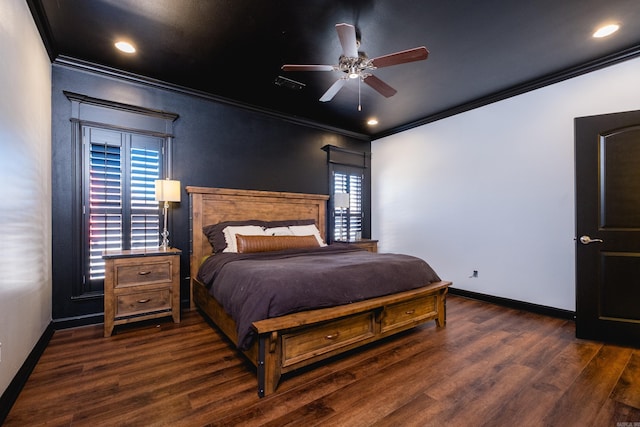 bedroom with baseboards, wood finished floors, and ornamental molding