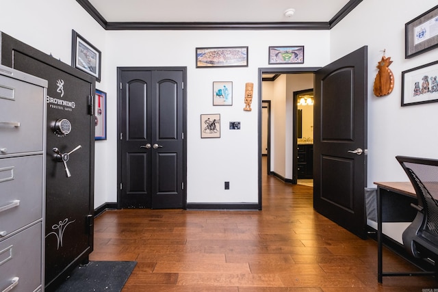 office area featuring baseboards, ornamental molding, and dark wood finished floors