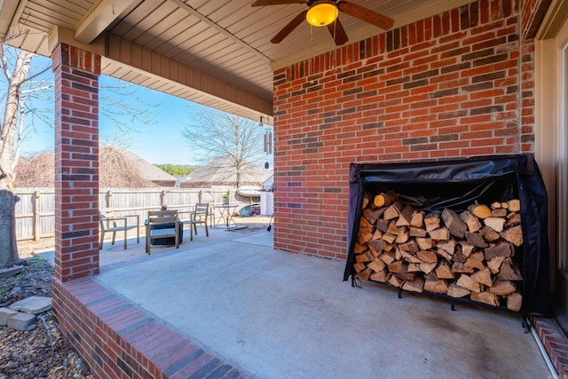 view of patio / terrace featuring ceiling fan, outdoor dining space, and a fenced backyard