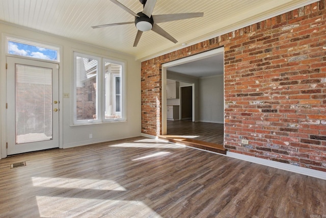 unfurnished sunroom with wooden ceiling, ceiling fan, visible vents, and a wealth of natural light