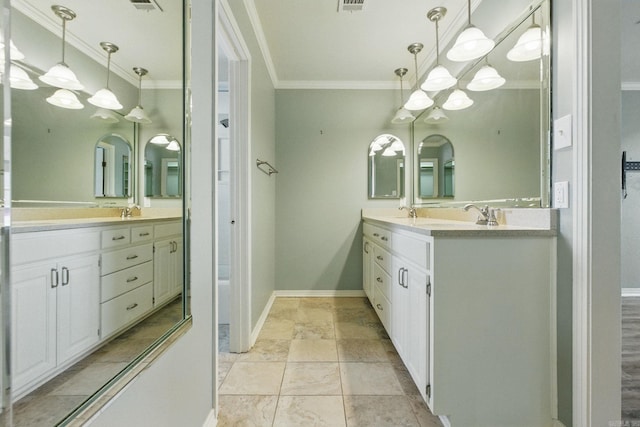 bathroom with visible vents, crown molding, vanity, and baseboards