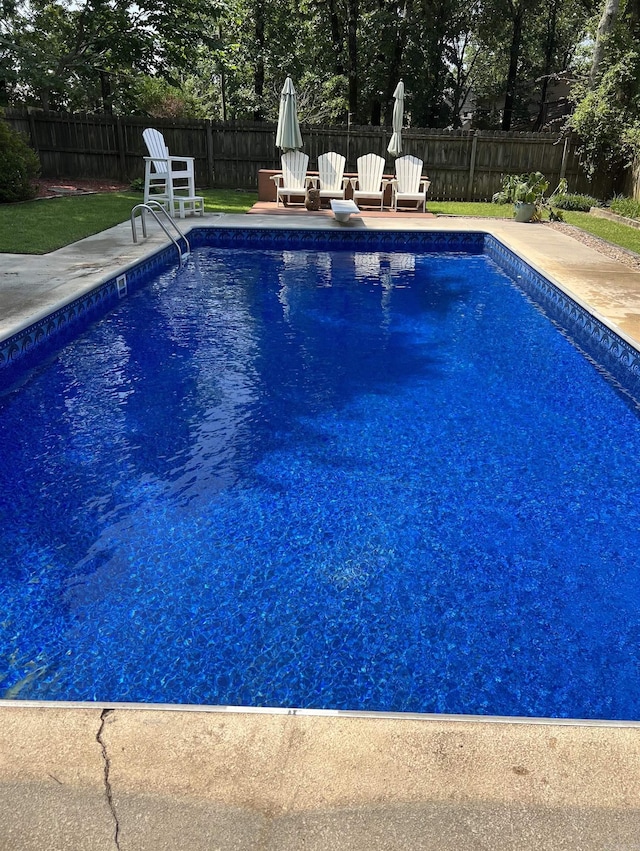 view of pool with a fenced in pool, a patio area, and a fenced backyard