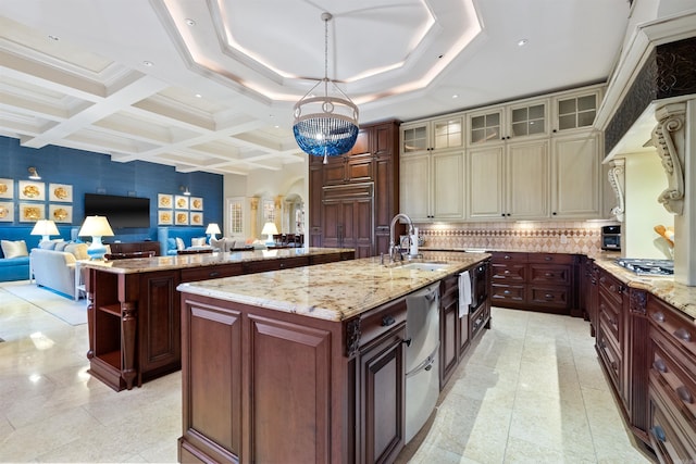 kitchen featuring arched walkways, coffered ceiling, a sink, open floor plan, and a large island with sink