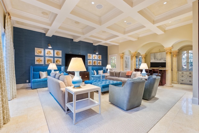 interior space featuring ornate columns, an accent wall, and coffered ceiling