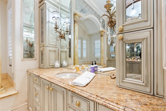 bathroom featuring crown molding and vanity