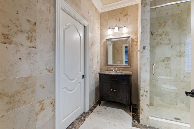 full bathroom with a stall shower, tile walls, and vanity