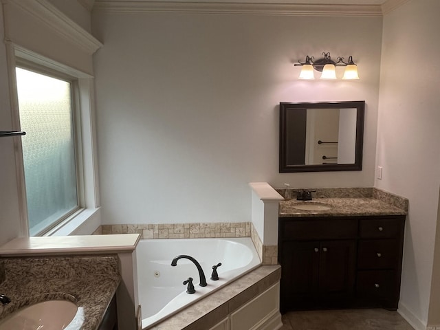 full bath with ornamental molding, a jetted tub, and vanity