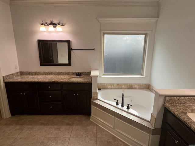 full bath with ornamental molding, a garden tub, vanity, and tile patterned floors