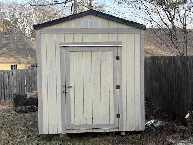 view of shed with a fenced backyard