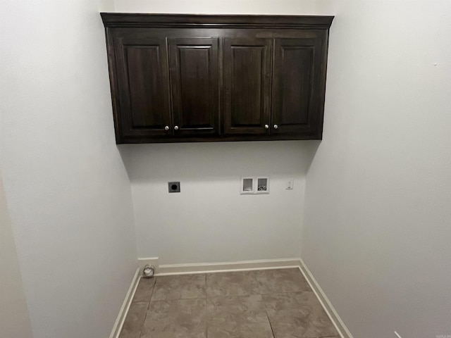 laundry room featuring hookup for a washing machine, cabinet space, baseboards, and hookup for an electric dryer