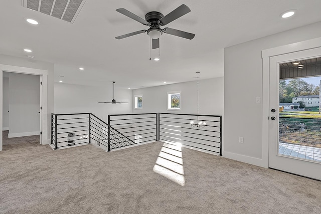 carpeted spare room featuring baseboards, visible vents, a ceiling fan, and recessed lighting