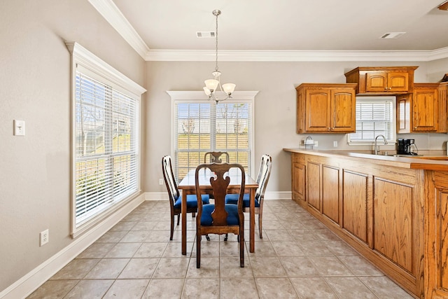 dining space featuring plenty of natural light, visible vents, and baseboards