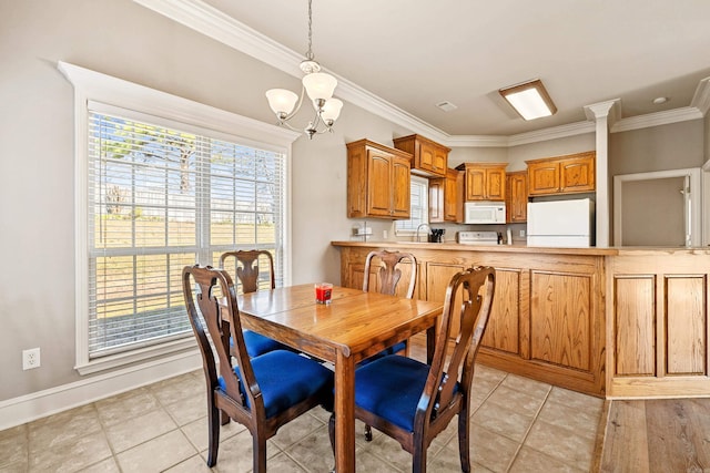 dining space with light tile patterned floors, ornamental molding, and a notable chandelier