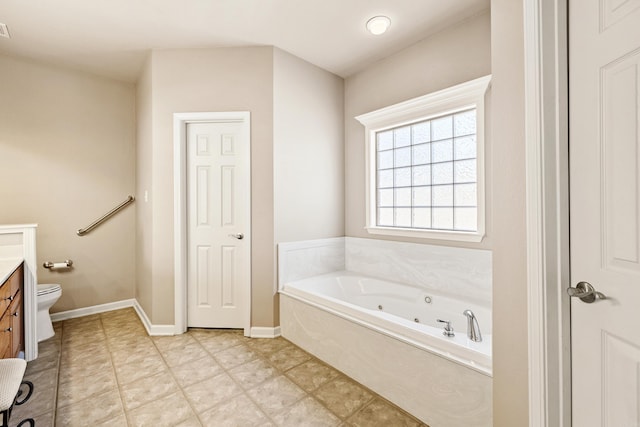 full bathroom with toilet, visible vents, vanity, baseboards, and a whirlpool tub