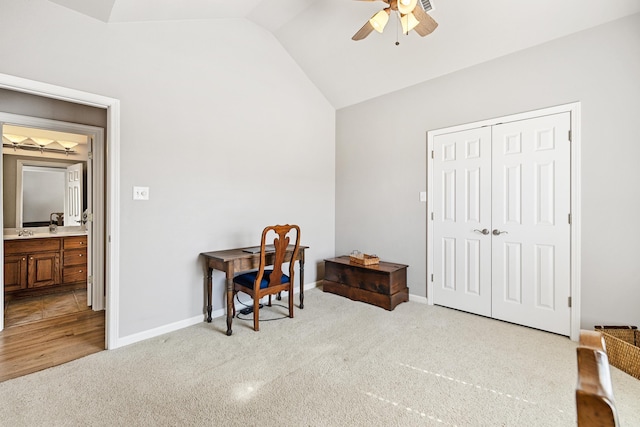 office featuring vaulted ceiling, ceiling fan, carpet floors, and baseboards