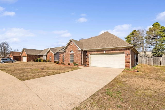 ranch-style house featuring brick siding, a shingled roof, concrete driveway, an attached garage, and fence