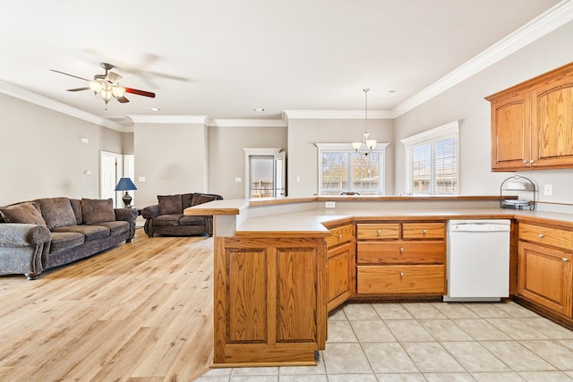 kitchen featuring open floor plan, light countertops, white dishwasher, and a peninsula