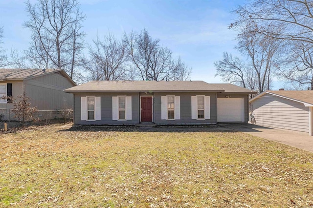 ranch-style house with a garage, fence, concrete driveway, and a front yard