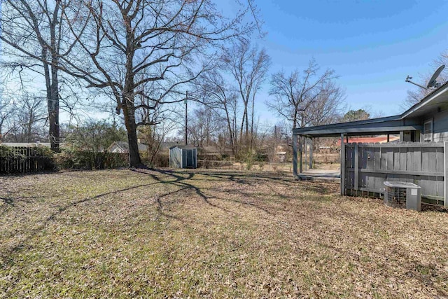 view of yard featuring cooling unit and fence