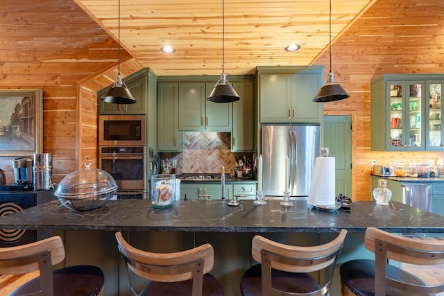 kitchen with wooden ceiling, wooden walls, stainless steel appliances, green cabinets, and backsplash