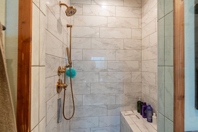 bathroom with a tile shower