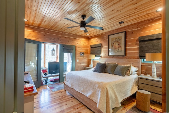 bedroom with access to exterior, wood walls, wooden ceiling, and light wood-style floors