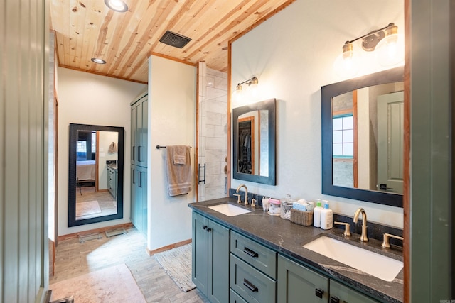 full bath featuring wood finished floors, wooden ceiling, a sink, and connected bathroom