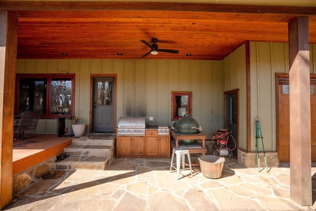 view of patio featuring area for grilling and a ceiling fan