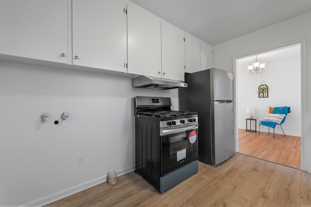 kitchen with light wood-style flooring, appliances with stainless steel finishes, white cabinets, under cabinet range hood, and baseboards