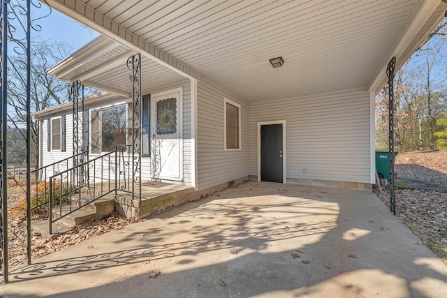 exterior space with driveway and an attached carport