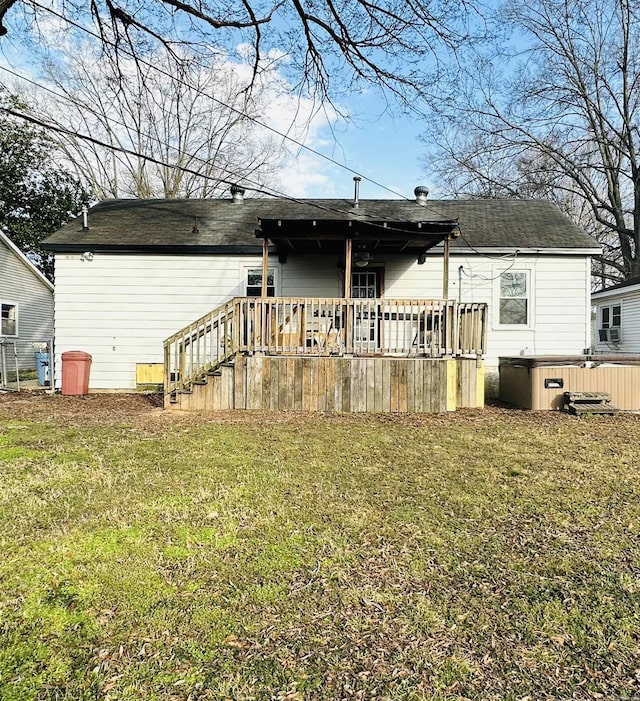 back of house with a lawn and a wooden deck