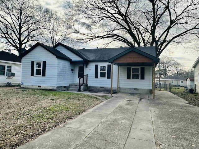 view of front of property with crawl space, a shingled roof, and fence